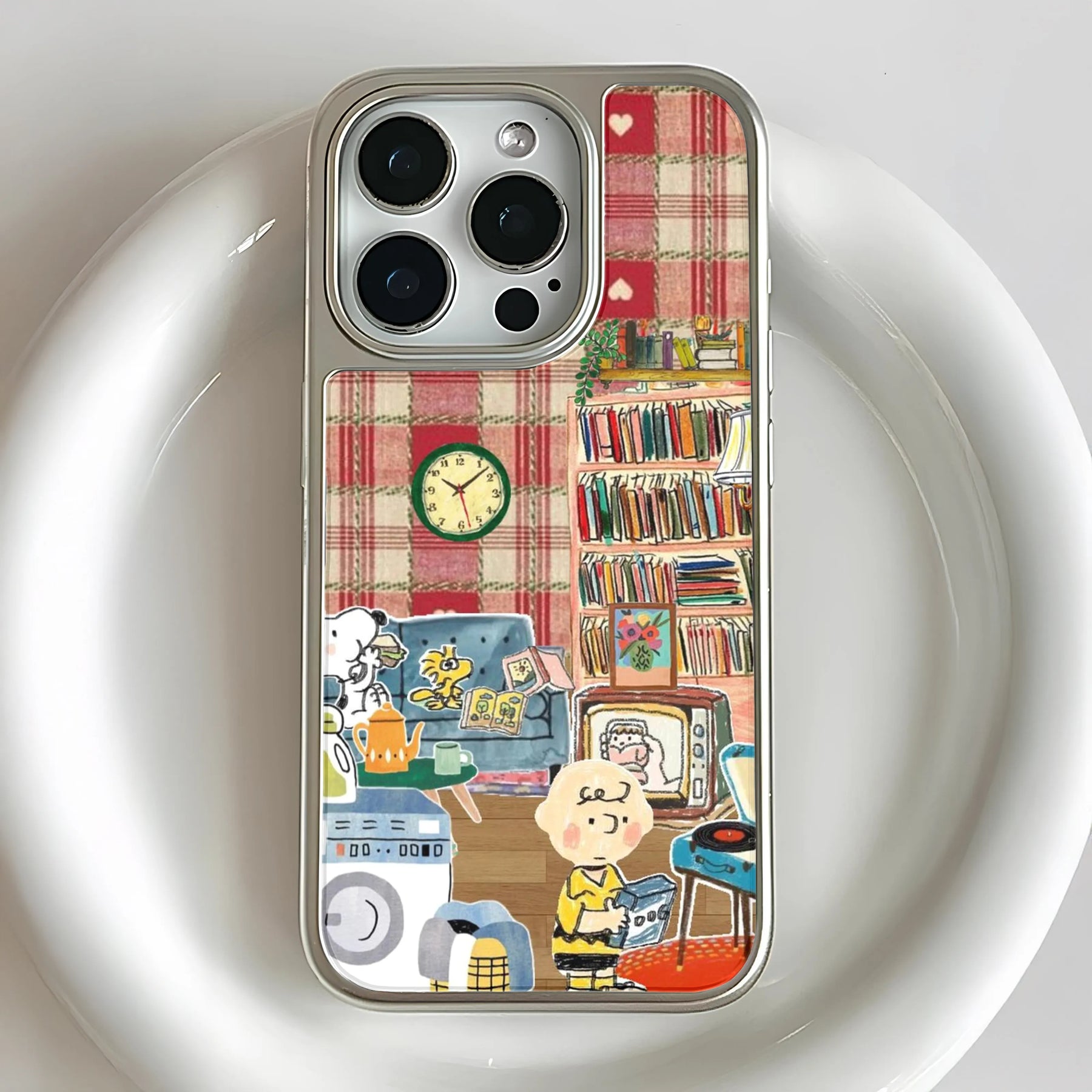 Silver phone case with red plaid cartoon room design, close-up rear angle