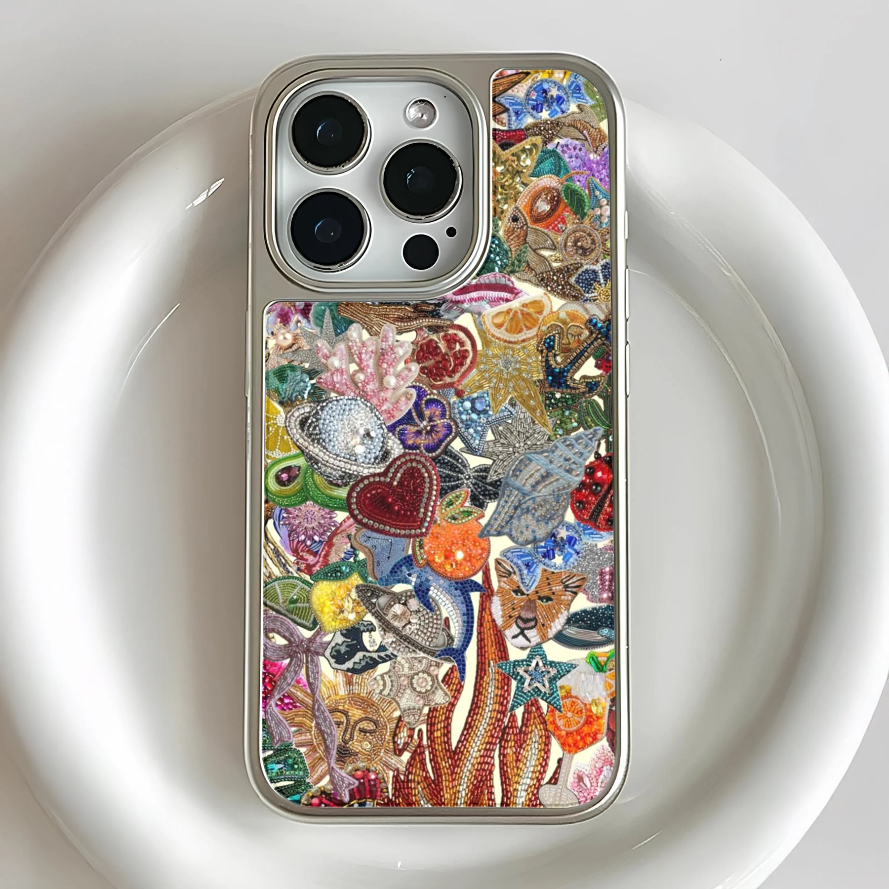 Silver smartphone case with colorful beaded sea motif, close-up rear angle for product page