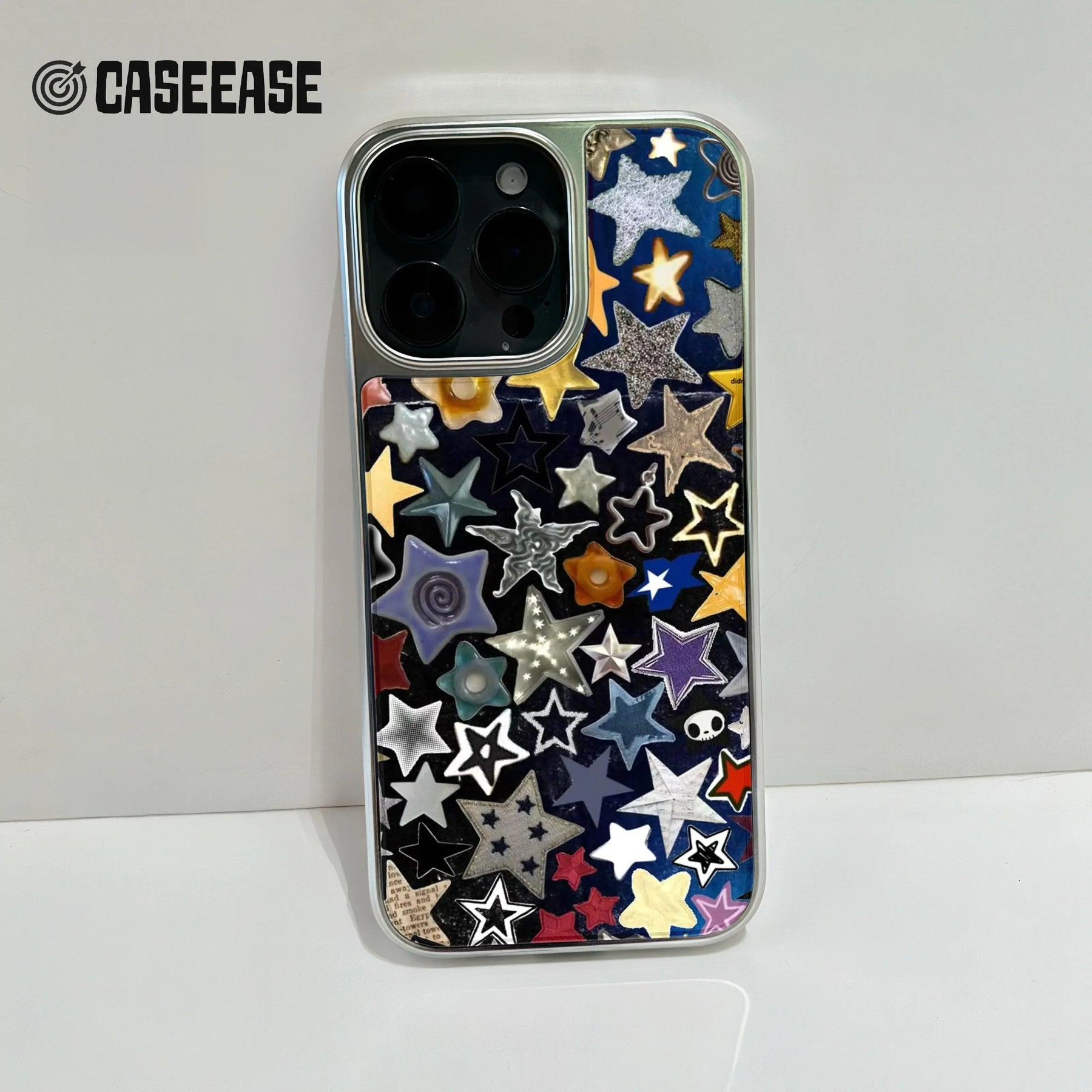 Silver-edged CASEEASE phone case with colorful star collage, rear camera close-up