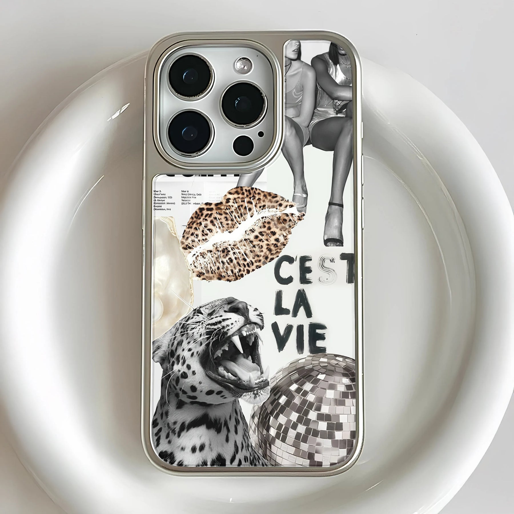 Silver collage phone case close-up showing camera cutout, leopard and disco ball design