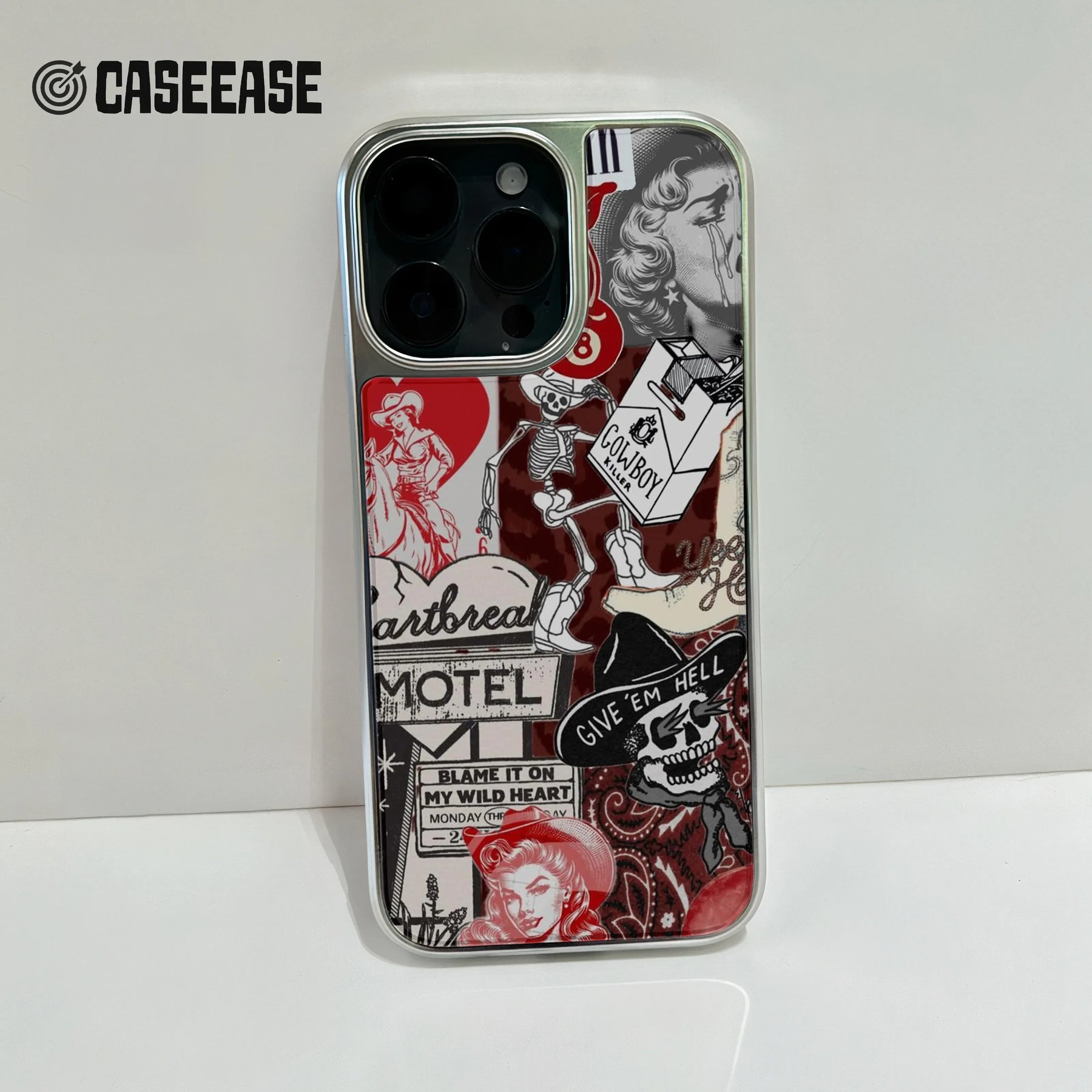 Silver iPhone case with red black western collage, rear close-up showing camera cutout