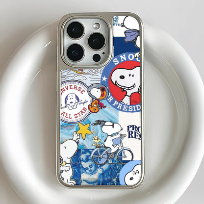 Silver iPhone case with colorful Snoopy collage design, rear close-up camera angle