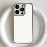 Silver and white leopard pattern smartphone case, close-up rear camera angle