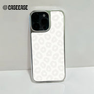 White leopard print smartphone case with silver edges, rear camera close-up