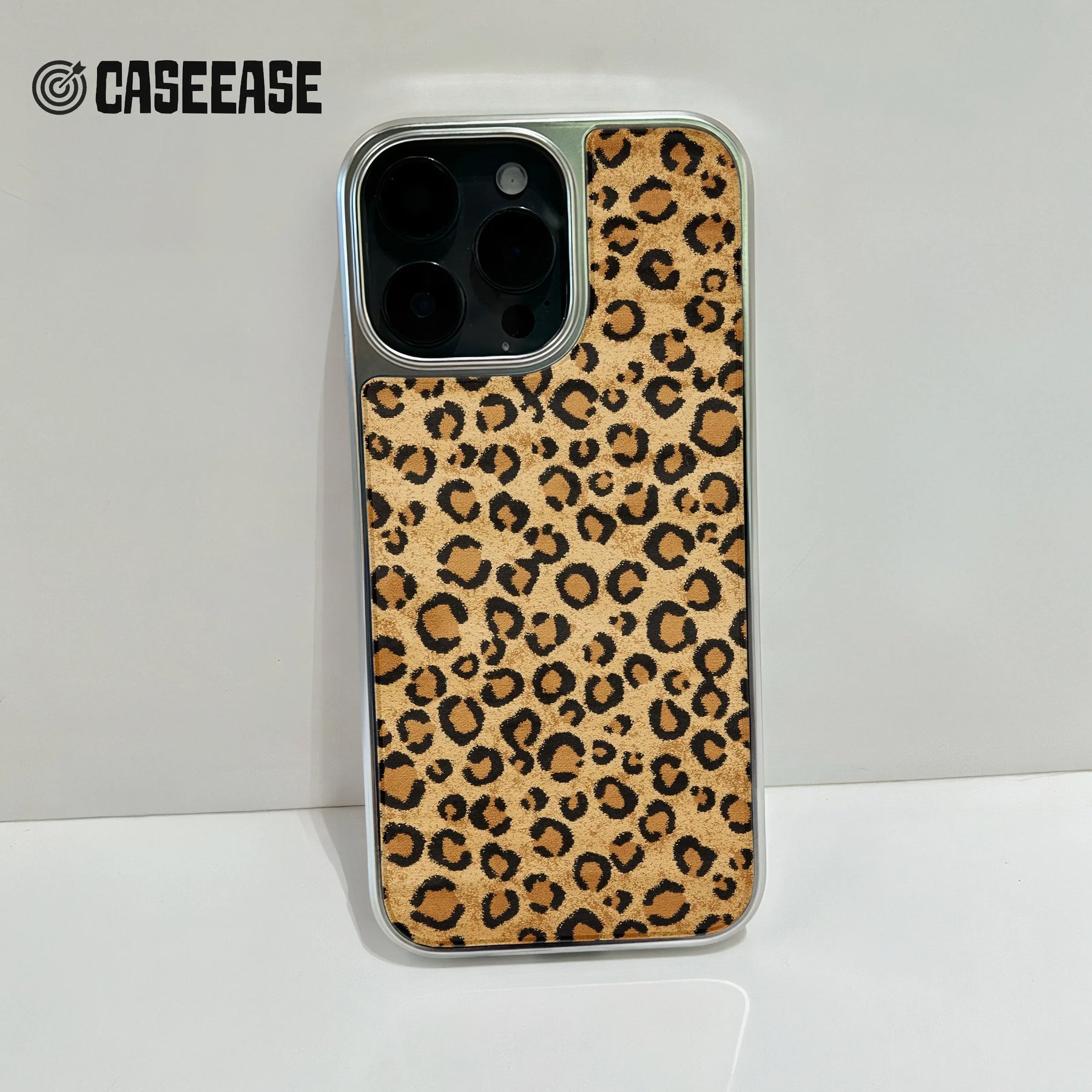 Tan and black leopard print phone case close-up, rear camera angle