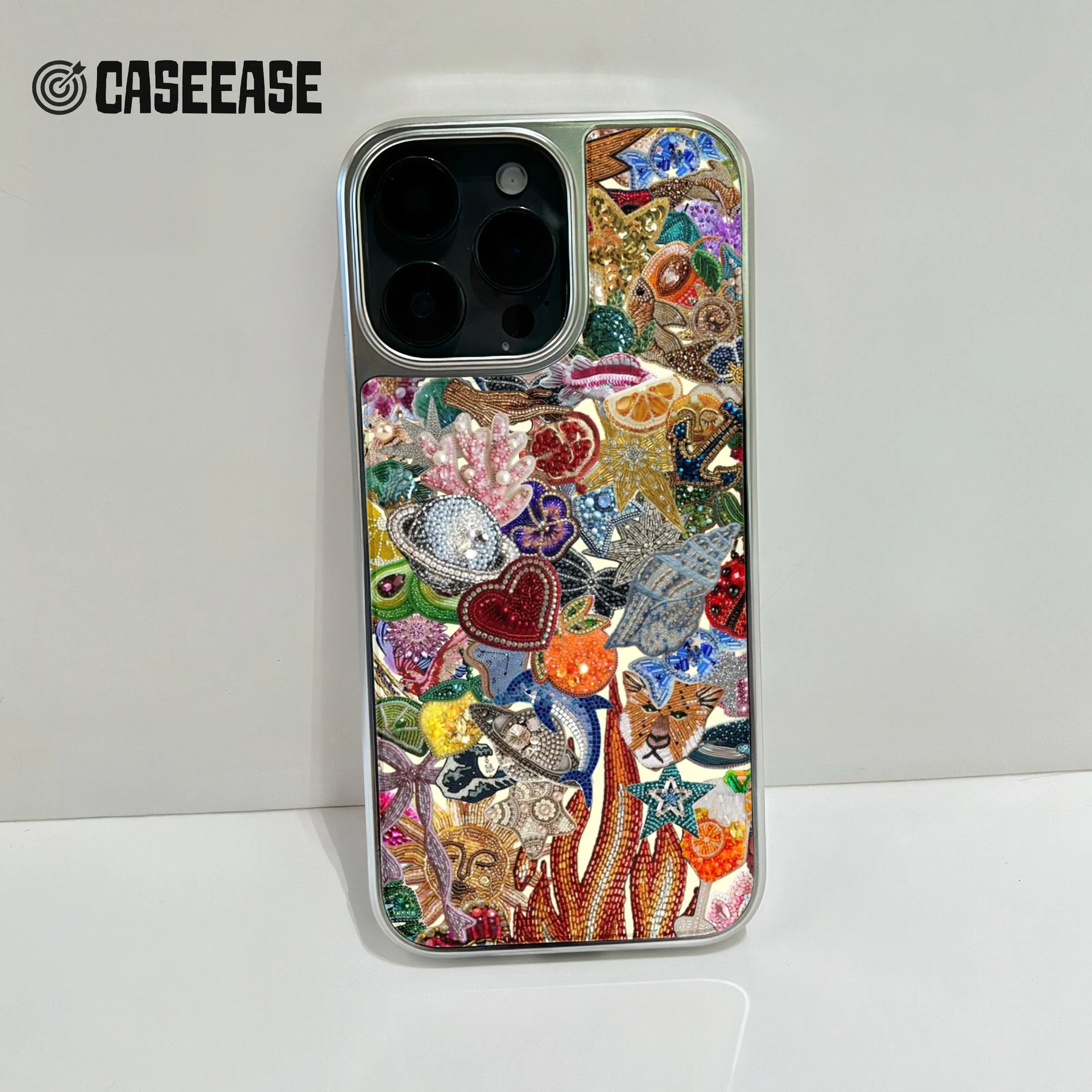 Silver phone case with colorful beaded sea life design, rear camera close-up