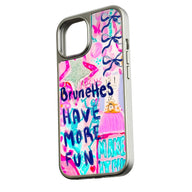 Silver phone case with pink doodle artwork and Brunettes Have More Fun text, angled side view