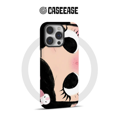 Peach, black, and white cartoon eye phone case shown from rear angle