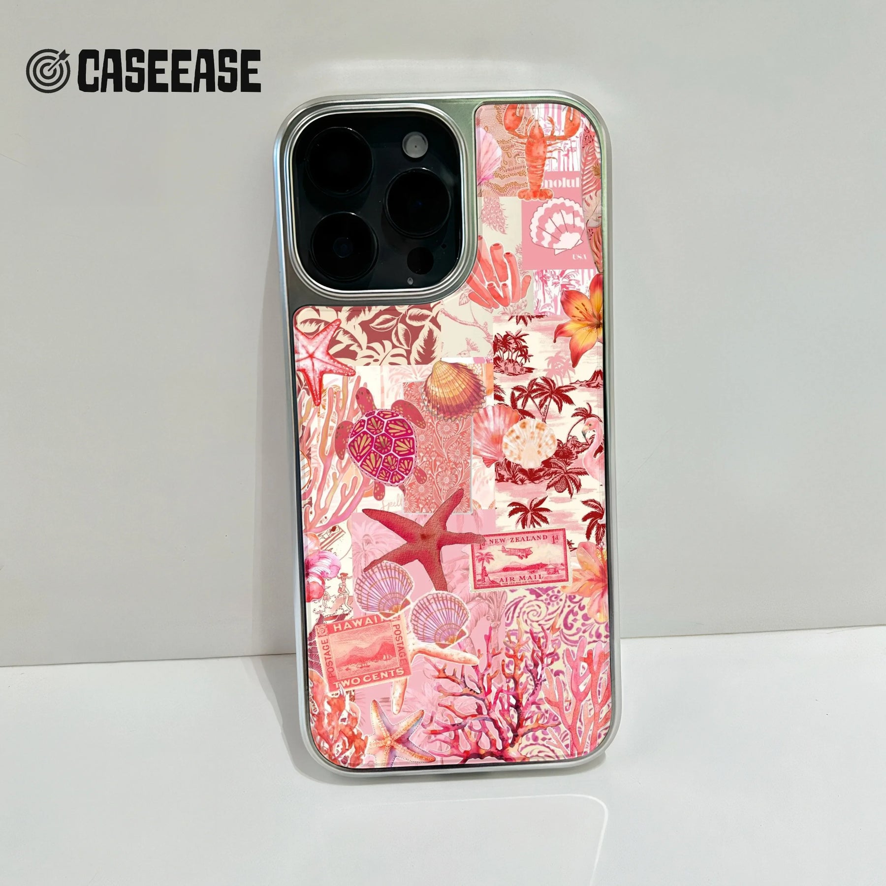 Silver phone case with pink ocean collage design shown from rear close-up