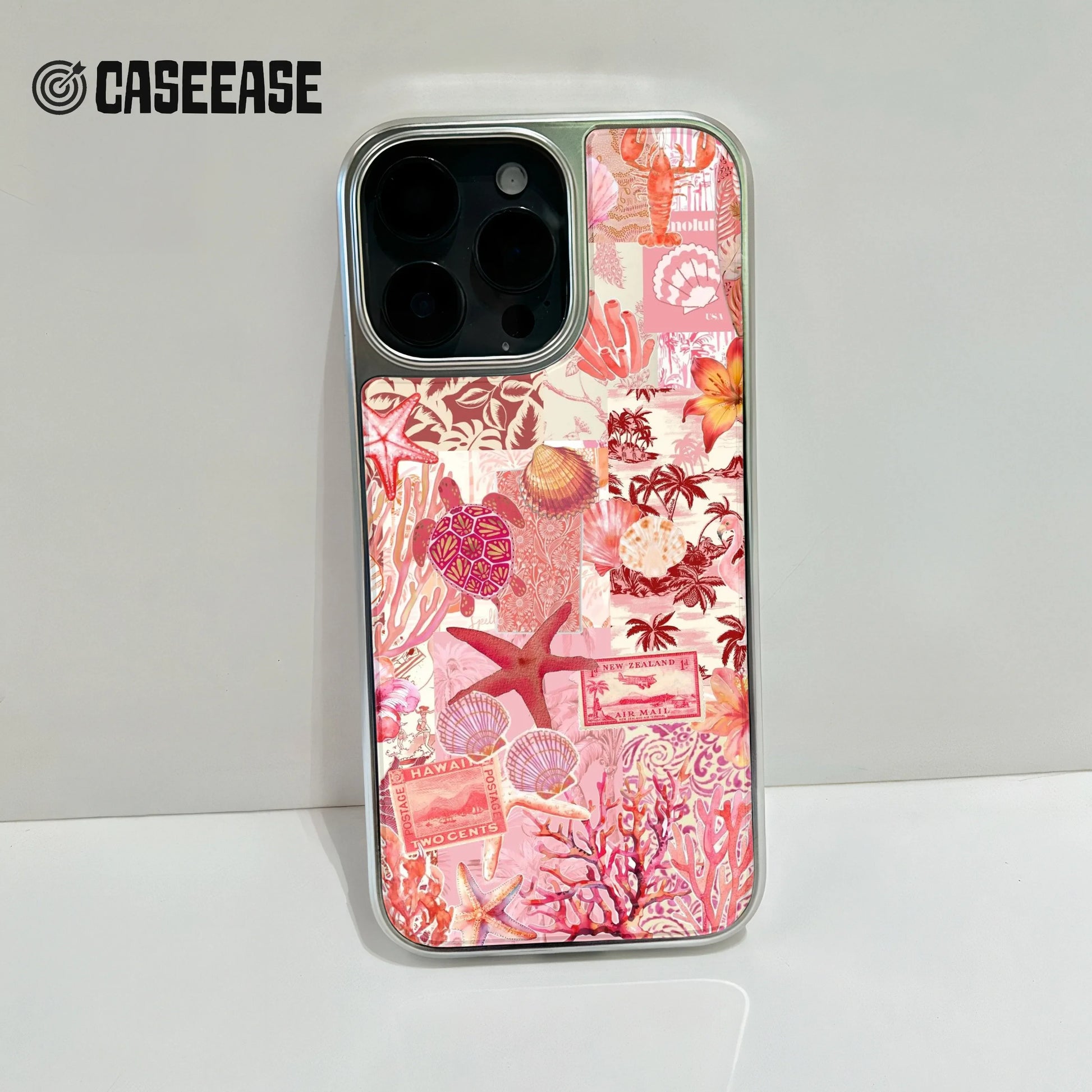 Silver phone case with pink ocean collage design shown from rear close-up