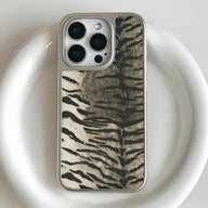 Silver-edged zebra print phone case shown close-up from rear for Shopify product page