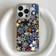 Close-up rear view of silver iPhone in clear case with colorful star pattern