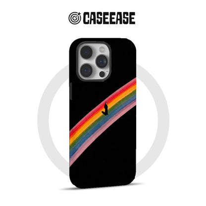 Black CASEEASE iPhone case with diagonal rainbow surfer design, shown from rear angle