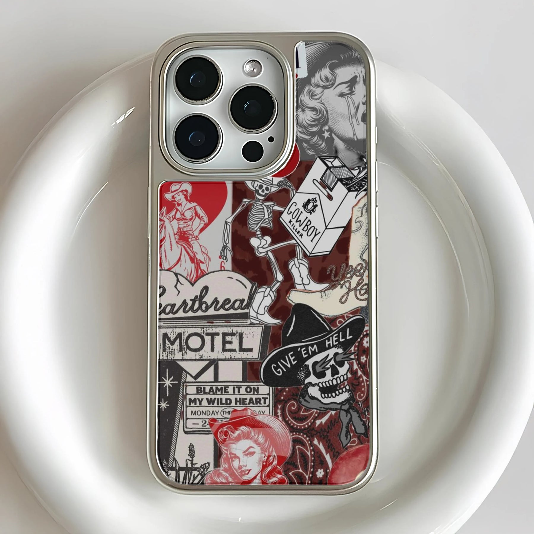Silver phone case with red and black western collage, close-up rear angle