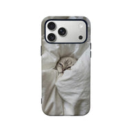 Gray cat in white blanket print phone case, rear view with camera cutout
