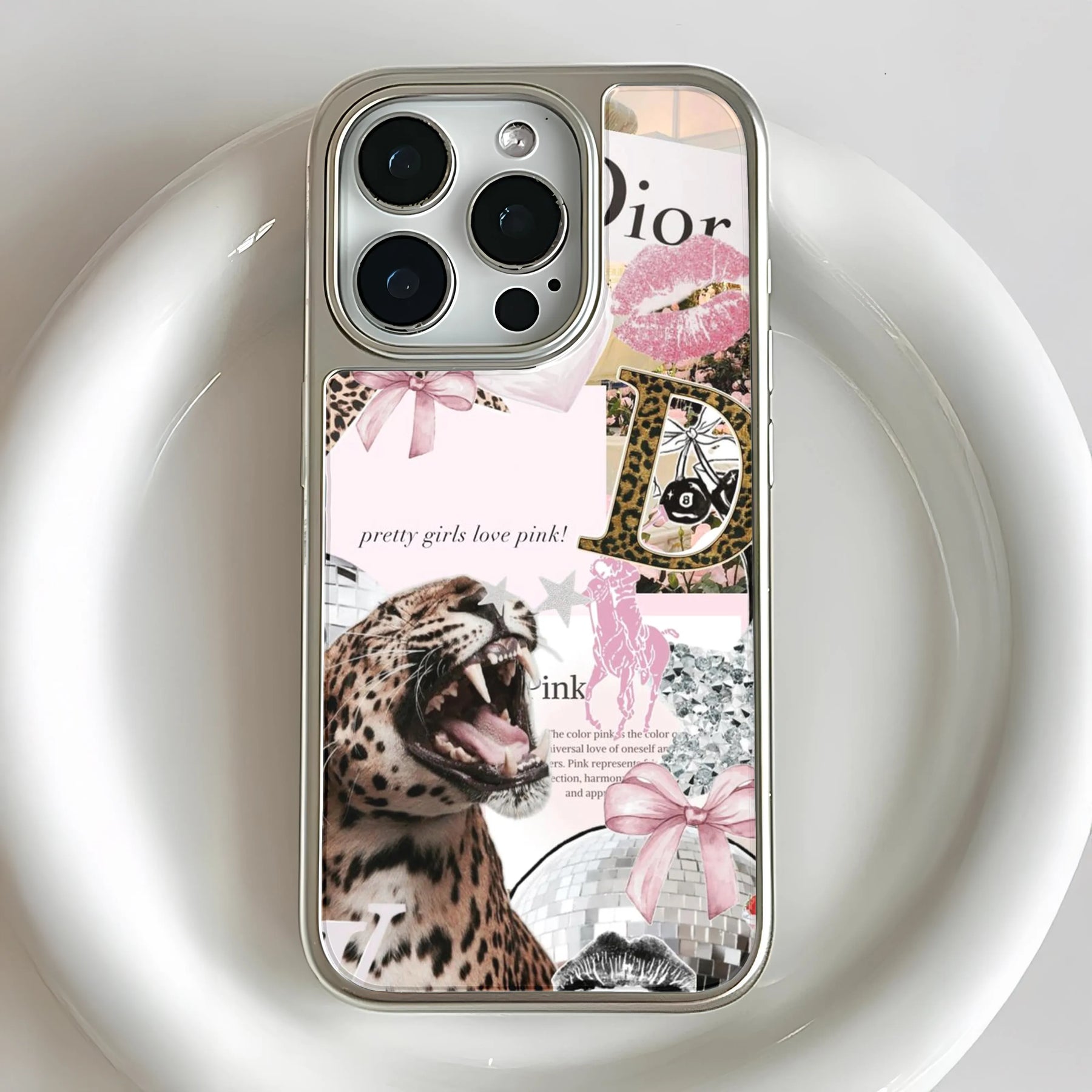 Silver iPhone case with pink leopard collage design, rear close-up product angle