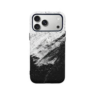 Black and white splatter plastic phone case shown from rear on smartphone