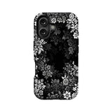Black phone case with white floral pattern, rear camera cutout, product back view