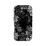 Black phone case with white floral pattern, rear camera cutout, product back view