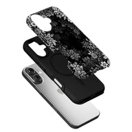 Black floral phone case with white pattern, angled exploded product display