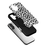 Black and white leopard print phone case shown angled above smartphone with layered back cover