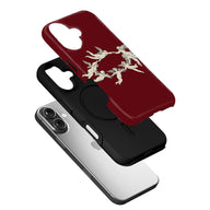 Burgundy plastic phone case with cherub artwork, angled exploded product view over smartphone