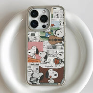 Silver iPhone case with Snoopy comic collage design, close-up rear camera angle