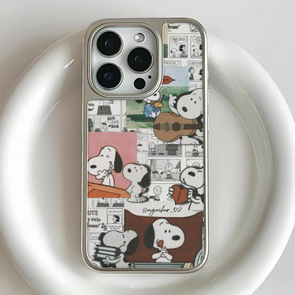 Silver iPhone case with Snoopy comic collage design, close-up rear camera angle